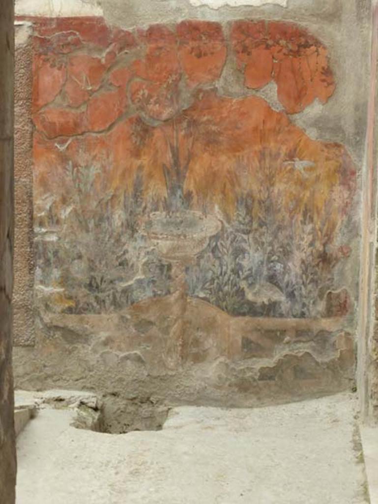 V 7, Herculaneum, June 2014. South-east corner of internal courtyard with garden painting with fountain on east wall. Photo courtesy of Michael Binns.